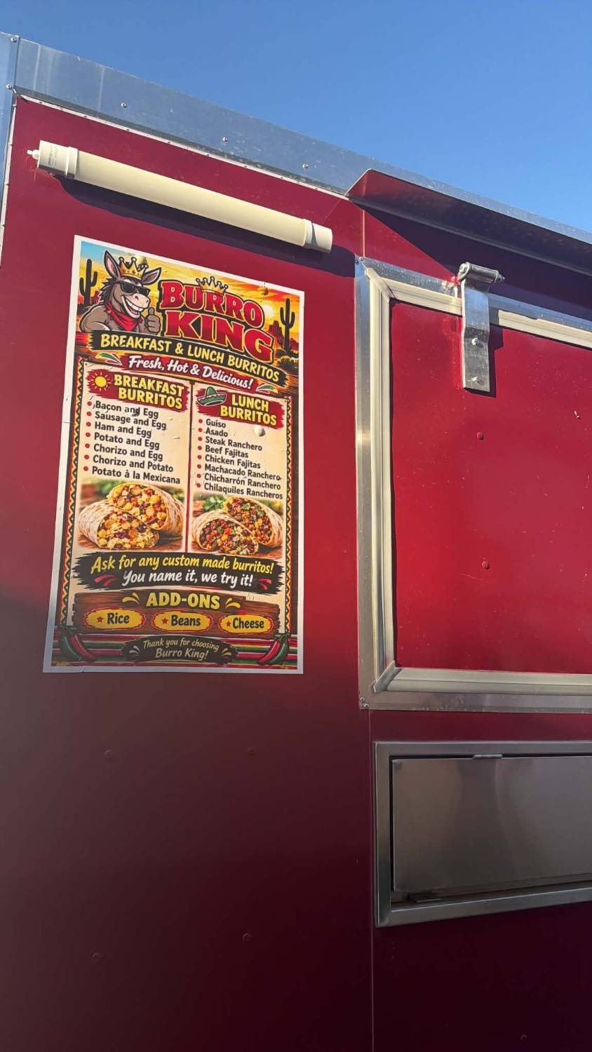 The red Burro King food truck with its menu poster